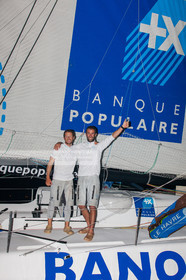 .Arrival in Imoca Banque Populaire Costa Rica on November 19, 2011. Skippers Armel Le Cleac'h and Christopher Pratt placed third in the Imocas category. Photo © Jean-marie Liot   DPPI