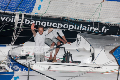 .Arrival in Imoca Banque Populaire Costa Rica on November 19, 2011. Skippers Armel Le Cleac'h and Christopher Pratt placed third in the Imocas category. Photo © Jean-marie Liot   DPPI